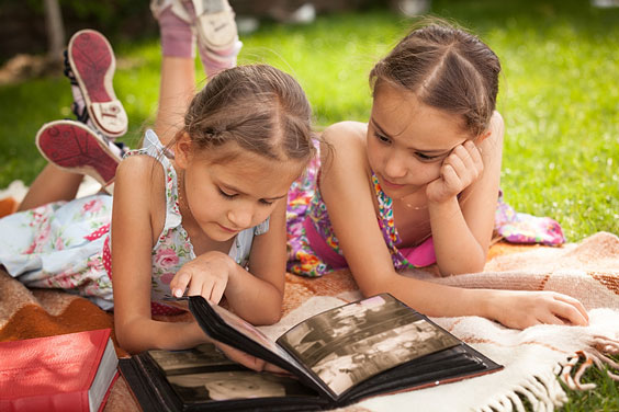 Children Perusing a Photo Album