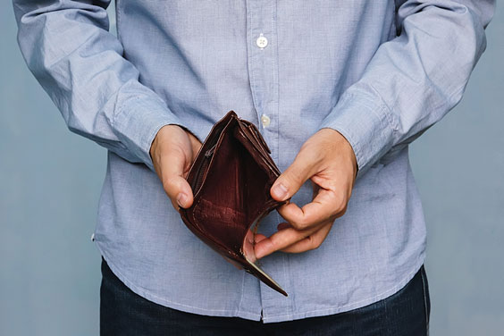 Man Holding an Empty Wallet