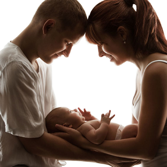Young Couple Holding their Recently Born Baby