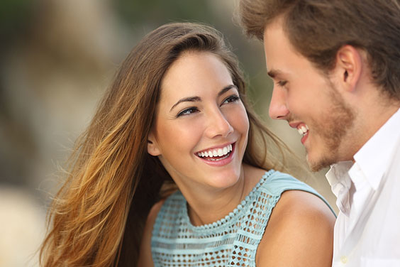 Smiling Couple against a Blurred Background