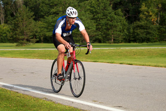 Triathlete Cycling on a Road Bike