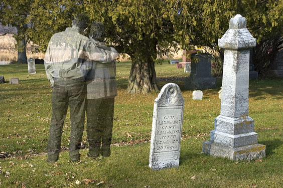 Couple Standing in a Cemetery