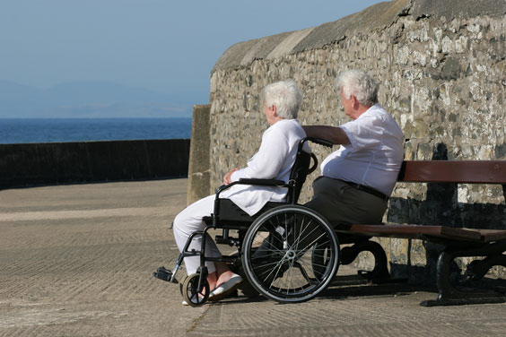 Disabled Elderly Woman Gazing at the Sea