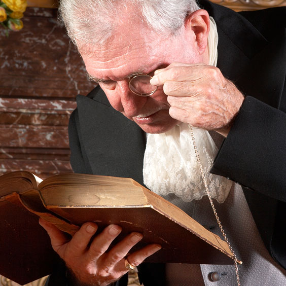 Elderly Gentleman Reading with an Eyeglass