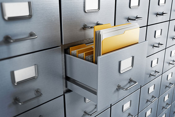 Filing Papers in File Cabinet