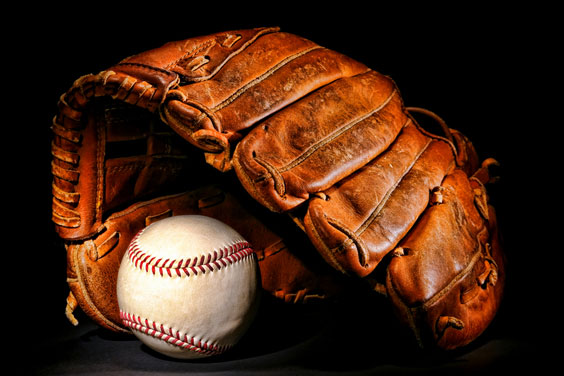 Baseball Glove and Ball on a Black Background