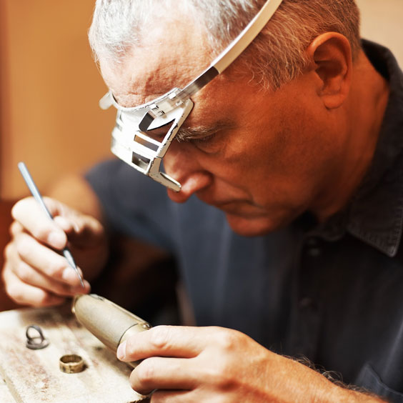 Jeweler, Wearing a Loupe, Making a Ring