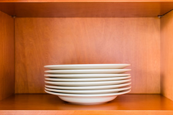 Wood Kitchen Cabinet with White Bowls