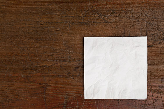 White Napkin on an Old Wooden Table