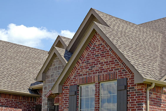 Asphalt Roof Shingles on a Brick House