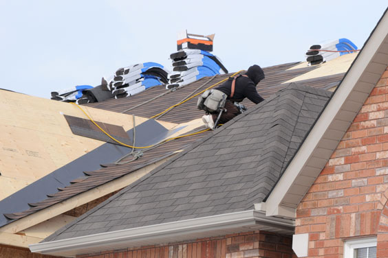 Roofer Installing Asphalt Shingles