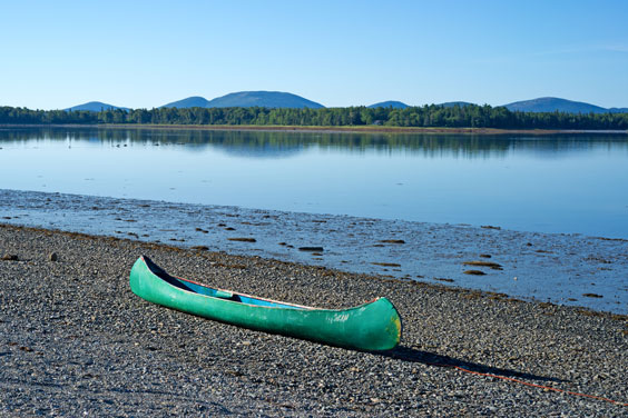 Canoe on a Lake Shore