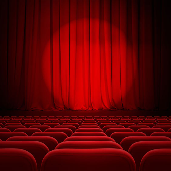 Red Seats and Red Curtain in a Theater